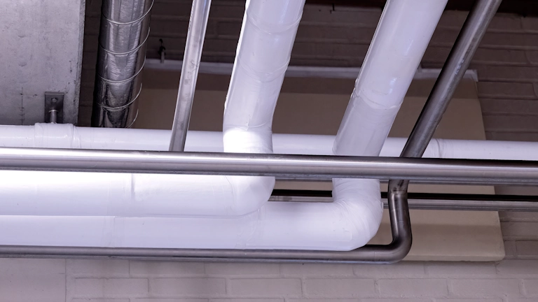 Piping in dairy insulated with Dan-isoCLEAN pipe insulation EC-ISO from Dan-iso