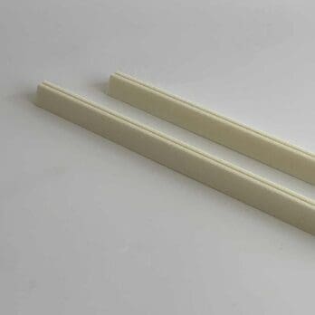Polyurethane alarm wire holders for securing alarm wire under foam insulation of pipes.