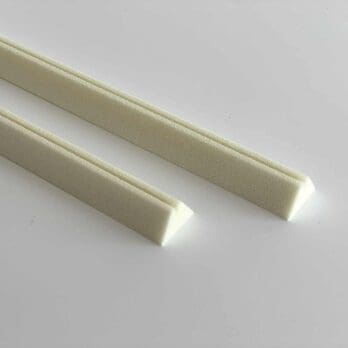 Polyurethane alarm wire holders for securing alarm wire under foam insulation of pipes.