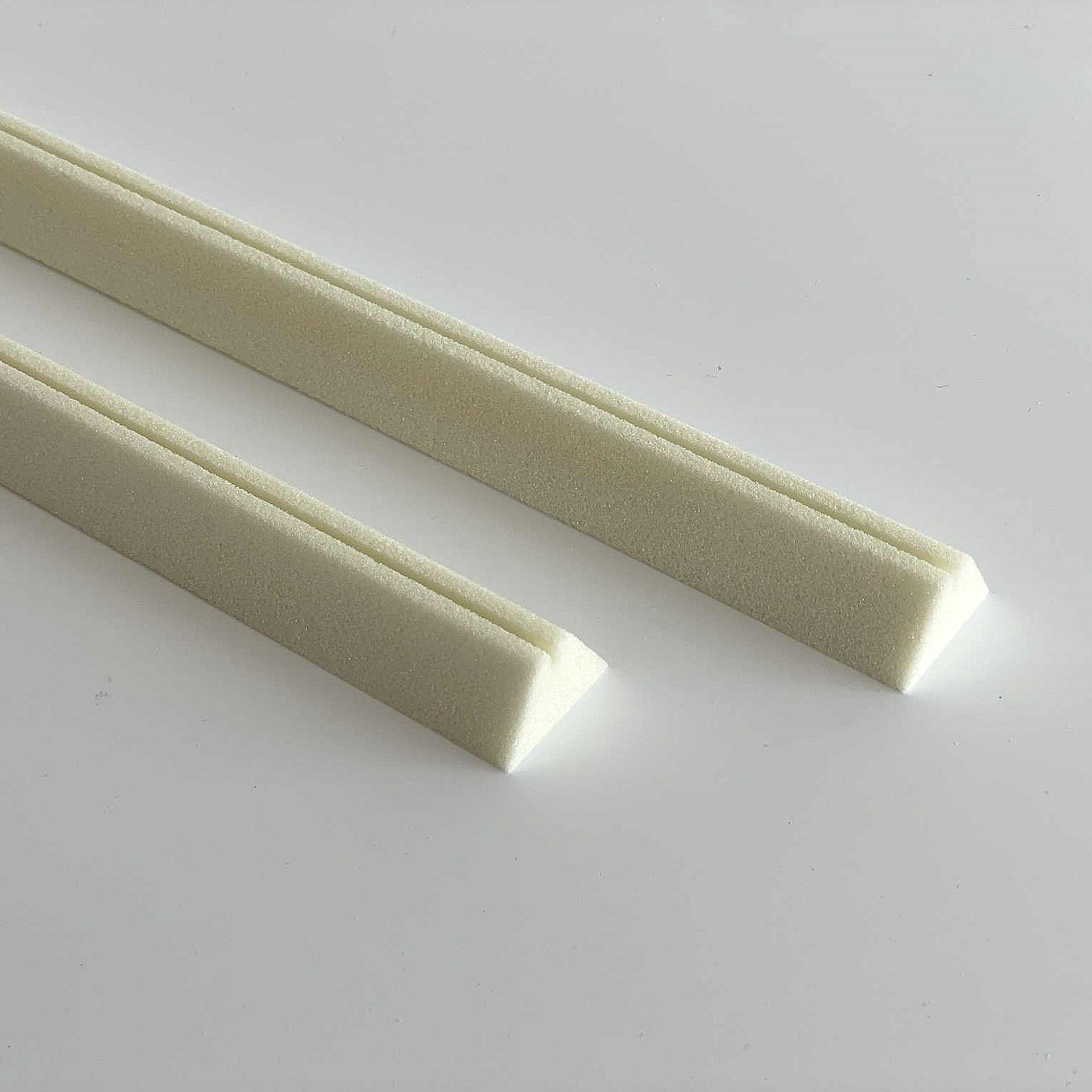 Polyurethane alarm wire holders for securing alarm wire under foam insulation of pipes.